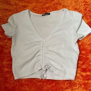 A plain white Corp top